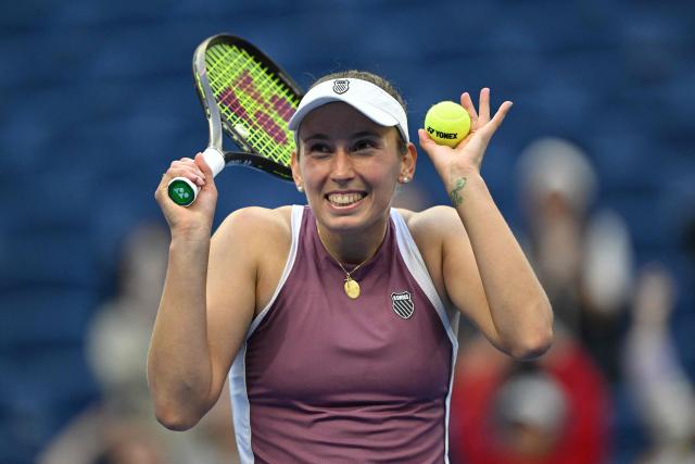 Belgium's Elise Mertens reacts as she celebrates her victory against USA's Coco Gauff during their women's singles match at the China Open tennis tournament in Beijing on October 7, 2026. (Photo by Adek BERRY / AFP)