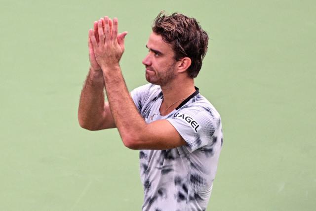 Czech Republic's Tomas Machac celebrates beating China's Zhizhen Zhang in their men's singles match at the Shanghai Masters tennis tournament in Shanghai on October 7, 2026. (Photo by Hector RETAMAL / AFP)