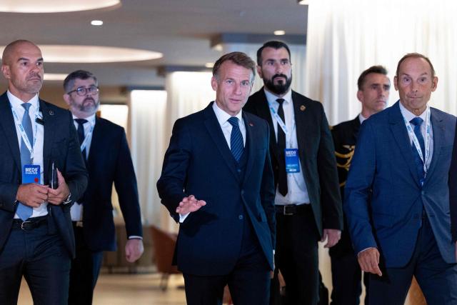 France's President Emmanuel Macron (C) arrives for the group photo of the heads of states and governments participating during the MED9 summit in Split on October 7, 2026, where the leaders of nine EU nations and invited leaders are gathering. (Photo by MARKO PERKOV / AFP)