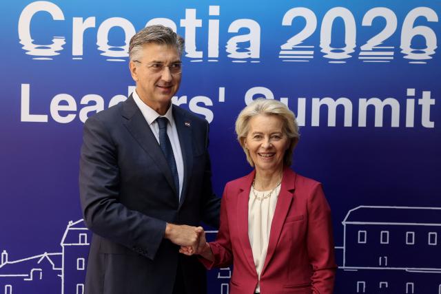 Croatia's Prime Minister Andrej Plenkovic (L) officially welcomes European Commission President Ursula von der Leyen during the MED9 summit in Split on October 7, 2026, where the leaders of nine EU nations and invited leaders are gathering. (Photo by MARKO PERKOV / AFP)