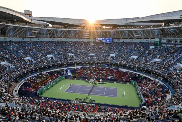 Czech Republic's Tomas Machac (R) hits a return to China's Zhizhen Zhang during their men's singles match at the Shanghai Masters tennis tournament in Shanghai on October 7, 2026. (Photo by Hector RETAMAL / AFP)