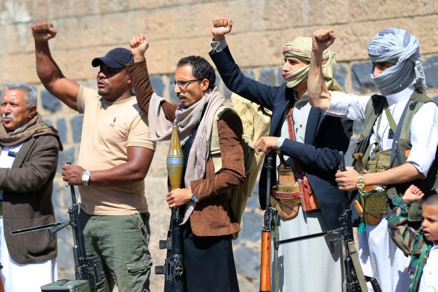 Fighters loyal to the Houthi authorities, take part in a rally to recruit more fighters, in Sanaa on October 7, 2026. The Houthis claimed a flurry of attacks on Saudi targets on October 7 including firing a ballistic missile at Riyadh airport, as the group battles for territory in Yemen against government forces supported by the kingdom. (Photo by Mohammed HUWAIS / AFP)