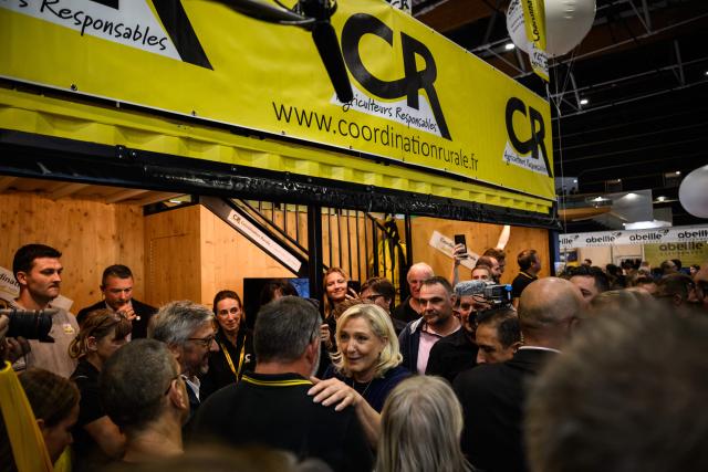 Far-right Rassemblement National (RN) presidential candidate Marine Le Pen greets supporters a she visits the Livestock Summit (Sommet de l'elevage) in Cournon-d'Auvergne on October 7, 2026.  (Photo by JEFF PACHOUD / AFP)