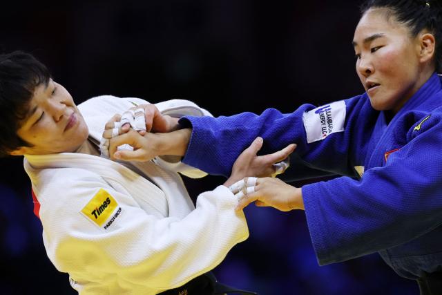 Japan's Haruka Kaju (white) competes against Mongolia's Gankhaich Bold in the women's under 63 kg quarter-final at the World Judo Championships in Baku on October 7, 2026. (Photo by Anne-Christine POUJOULAT / AFP)