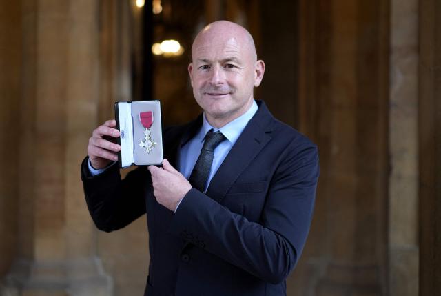 Irish former footballer Lee Carsley poses with their medal after being appointed a Member of the Order of the British Empire (MBE) at an investiture ceremony at Windsor Castle, in Windsor, west of London on October 7, 2026. (Photo by Andrew Matthews / POOL / AFP)