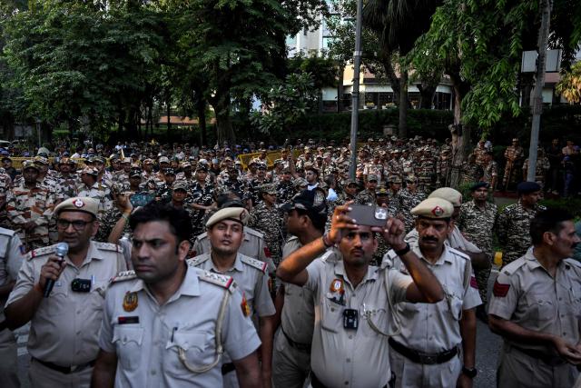 Security personnel stand guard during a protest by the opposition alliance INDIA bloc (Indian National Developmental Inclusive Alliance) in New Delhi on October 7, 2026 against the country's Chief Election Commissioner Gyanesh Kumar, calling for his resignation over alleged irregularities in the Special Intensive Revision (SIR) of electoral rolls. (Photo by Arun SANKAR / AFP)