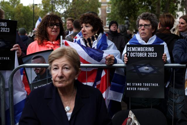People gather before a memorial service to mark the third anniversary of the Hamas attacks on Israel, in central London on October 7, 2026. (Photo by Adrian Dennis / AFP)