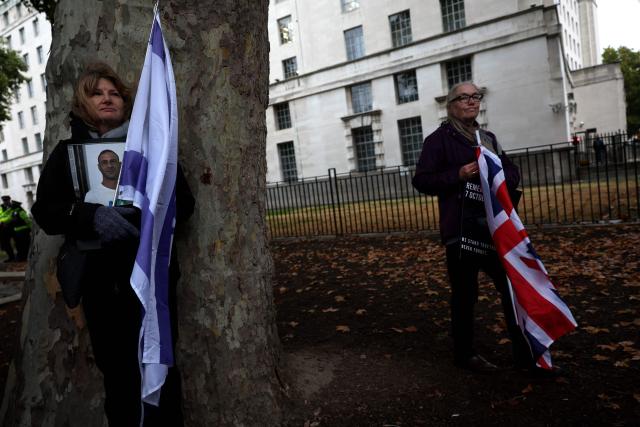 People gather before a memorial service to mark the third anniversary of the Hamas attacks on Israel, in central London on October 7, 2026. (Photo by Adrian Dennis / AFP)