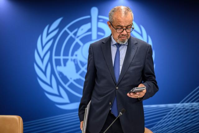 World Health Organization (WHO) Director-General Tedros Adhanom Ghebreyesus checks his phone after a press conference on global health issues, in Geneva on October 7, 2026. The WHO said it wanted more information from Russia on the death of a plague laboratory technician -- and on reports of "a second employee with pneumonia of undetermined cause". WHO's chief said full transparency was needed in order to make a proper assessment of the public health risk. (Photo by Fabrice COFFRINI / AFP)