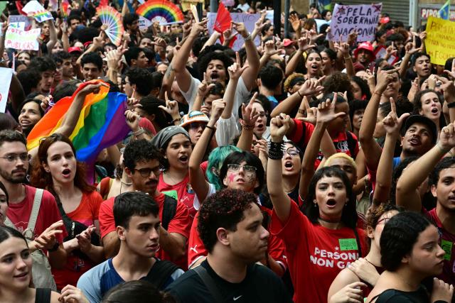 Students backing Brazil's President and presidential candidate Luiz Inacio Lula da Silva for the runoff election shout slogans during a march against the far right, in Rio de Janeiro, Brazil on October 7, 2026. Lula da Silva, who has risen from the political ashes several times, is heading to a runoff election against right-wing senator Flavio Bolsonaro on October 25, after a shock second-place finish in the first-round vote. (Photo by Pablo PORCIUNCULA / AFP)