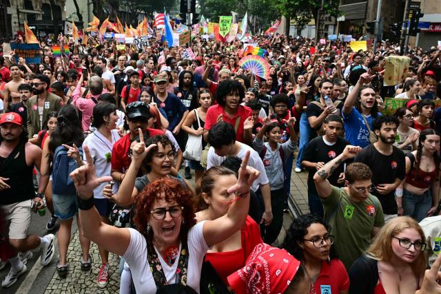 Students backing Brazil's President and presidential candidate Luiz Inacio Lula da Silva for the runoff election shout slogans during a march against the far right, in Rio de Janeiro, Brazil on October 7, 2026. Lula da Silva, who has risen from the political ashes several times, is heading to a runoff election against right-wing senator Flavio Bolsonaro on October 25, after a shock second-place finish in the first-round vote. (Photo by Pablo PORCIUNCULA / AFP)