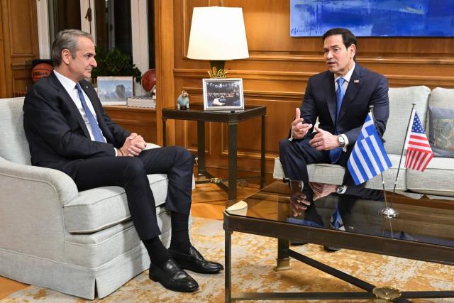 U.S. Secretary of State Marco Rubio speaks with Greek Prime Minister Kyriakos Mitsotakis (L)  in Athens on October 7, 2026. (Photo by Aris MESSINIS / POOL / AFP)