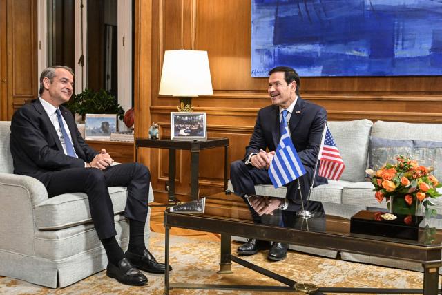 U.S. Secretary of State Marco Rubio speaks with Greek Prime Minister Kyriakos Mitsotakis (L)  in Athens on October 7, 2026. (Photo by Aris MESSINIS / POOL / AFP)