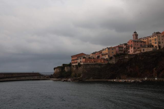 A man walks in the port of Bastia, on the French Mediterranean island of Corsica, on October 6, 2026. (Photo by Pascal POCHARD-CASABIANCA / AFP)