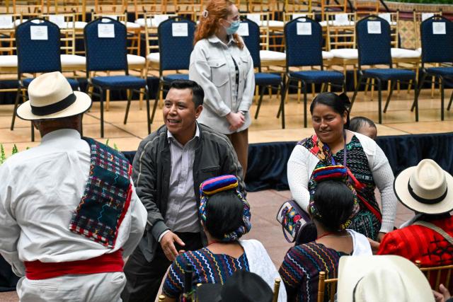 Mayan leader Bacilio Puac (2nd L) arrives at a ceremony during which Guatemala's President Bernardo Arevalo issued a public apology on behalf of the state to Indigenous leaders accused of leading the 2023 protests demanding the resignation of then Attorney General Consuelo Porras and respect for the presidential election results, at the National Palace of Culture in Guatemala City on October 7, 2026. (Photo by Johan ORDONEZ / AFP)