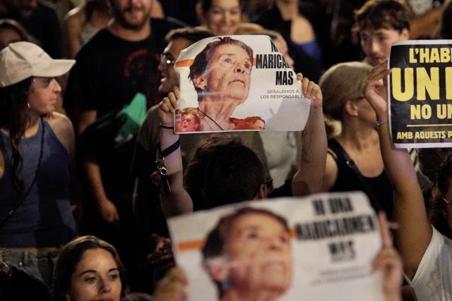 (FILES) Demonstrators hold signs reading 'Not a single more Maricarmen' in a reference to Maricarmen Abascal, an 87-year-old pensioner evicted from her Madrid home, during a protest against evictions and high rent prices on plaza Tetuan in Barcelona on October 5, 2026. Maricarmen Abascal died in hospital on October 7, 2026 according to a tenant's union announcement. (Photo by Manaure Quintero / AFP)