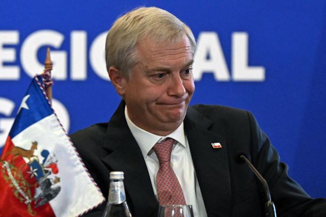 (FILES) Chile's President Jose Antonio Kast gestures during the meeting "Santiagos regional commitment against transnational organised crime" in Santiago on May 28, 2026. Kast has withdrawn a package of controversial crime-fighting proposals that had triggered street protests and divided his right-wing coalition on Ocotober 7, 2026. His failure to rally support for the proposals marks a major setback for the hardline lawyer, who won the presidency last year on a promise to crack down on organized crime and irregular migration. (Photo by RODRIGO ARANGUA / AFP)