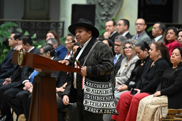 Mayan leader Miguel Vicente speaks at a ceremony during which Guatemala's President Bernardo Arevalo issued a public apology on behalf of the state to Indigenous leaders accused of leading the 2023 protests demanding the resignation of then Attorney General Consuelo Porras and respect for the presidential election results, at the National Palace of Culture in Guatemala City on October 7, 2026. (Photo by Johan ORDONEZ / AFP)