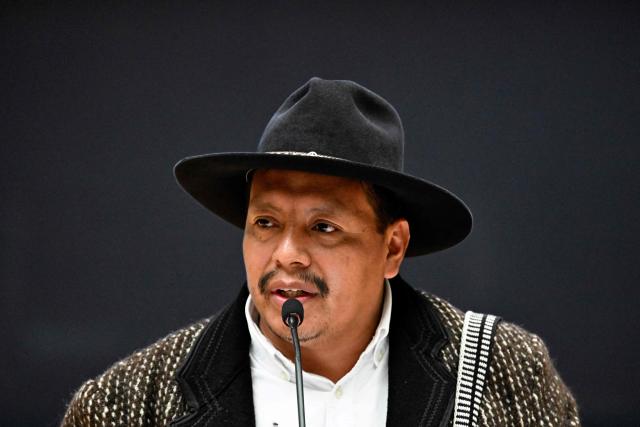 Mayan leader Miguel Vicente speaks at a ceremony during which Guatemala's President Bernardo Arevalo issued a public apology on behalf of the state to Indigenous leaders accused of leading the 2023 protests demanding the resignation of then Attorney General Consuelo Porras and respect for the presidential election results, at the National Palace of Culture in Guatemala City on October 7, 2026. (Photo by Johan ORDONEZ / AFP)