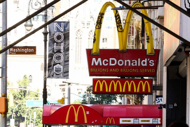 Fast food restaurant McDonald’s signs are seen in the Manhattan borough of New York City on October 7, 2026. (Photo by CHARLY TRIBALLEAU / AFP)