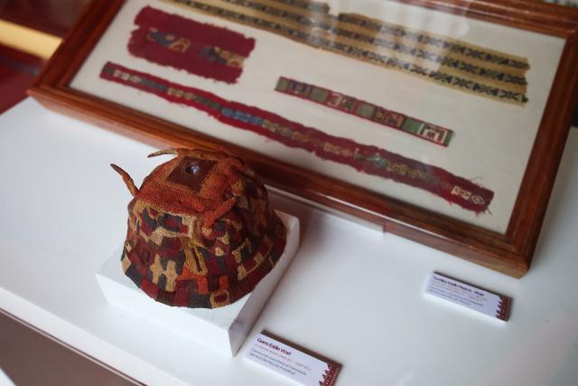 A Wari-style hat voluntarily returned to the Consulate General of Peru in Frankfurt is displayed during a ceremony marking the handover of 342 cultural artefacts repatriated from six countries to Peru's Ministry of Culture, at the Foreign Ministry headquarters in Lima on October 7, 2026. (Photo by Connie FRANCE / AFP)