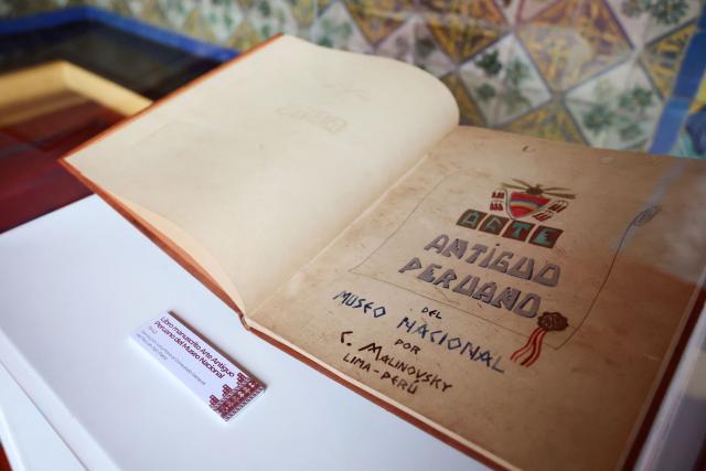 The handwritten book "Arte Antiguo Peruano" from the National Museum, voluntarily returned to the Consulate General of Peru in Sao Paulo, is displayed during a ceremony marking the handover of 342 cultural artefacts repatriated from six countries to Peru's Ministry of Culture, at the Foreign Ministry headquarters in Lima on October 7, 2026. (Photo by Connie FRANCE / AFP)