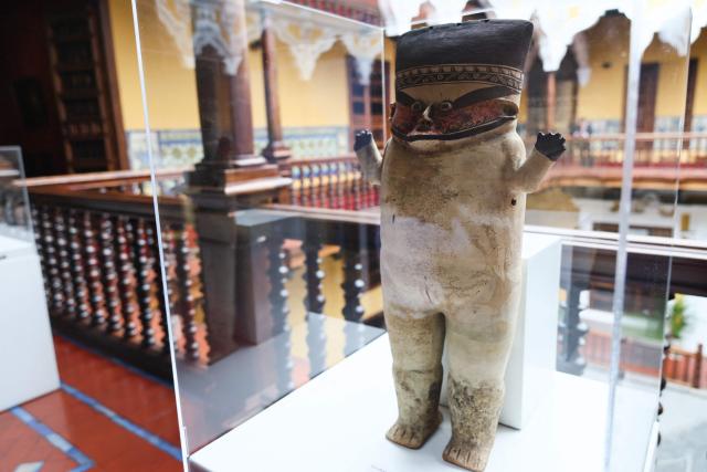 A Chancay-style sculpture voluntarily returned to the Embassy of Peru in the United Kingdom and Northern Ireland is displayed during a ceremony marking the handover of 342 cultural artefacts repatriated from six countries to Peru's Ministry of Culture, at the Foreign Ministry headquarters in Lima on October 7, 2026. (Photo by Connie FRANCE / AFP)