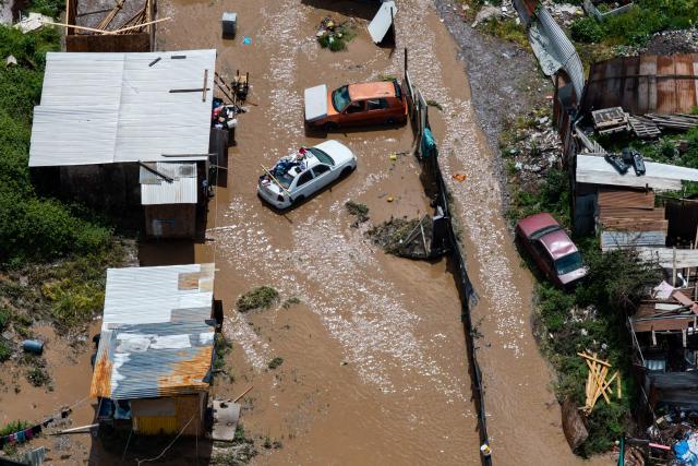 This aerial view shows a flooded area following the overflow of the Mapocho River in Talagante, Metropolitan Region, Chile, on October 7, 2026. (Photo by Javier TORRES / AFP)