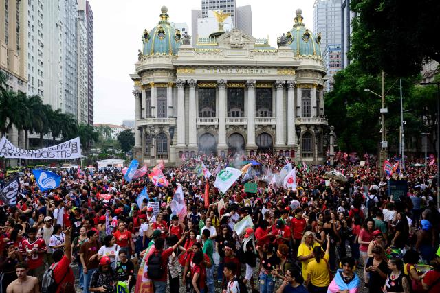 Students backing Brazil's President and presidential candidate Luiz Inacio Lula da Silva in the runoff election take part in a march against the far right in Rio de Janeiro, Brazil, on October 7, 2026. Lula da Silva, who has risen from the political ashes several times, is heading to a runoff election against right-wing senator Flavio Bolsonaro on October 25, after a shock second-place finish in the first-round vote. (Photo by Pablo PORCIUNCULA / AFP)