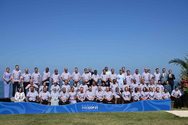 Pose for a family photo at the conclusion of the final day of the Pacific Pre-COP31 Summit in Nadi on October 8, 2026. This week's "pre-COP" meetings in the Fijian city of Nadi are a precursor to the larger UN-sponsored global climate summit -- known as COP31 -- to be held in Turkey next month. (Photo by SAEED KHAN / AFP)