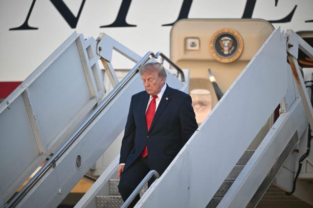 US President Donald Trump steps off Air Force One at Kelly Field in San Antonio, Texas, on October 7, 2026. Republican Senate candidate Ken Paxton is in a close race with Democratic candidate James Talarico for one of Texas' US Senate seats. (Photo by Mandel NGAN / AFP)