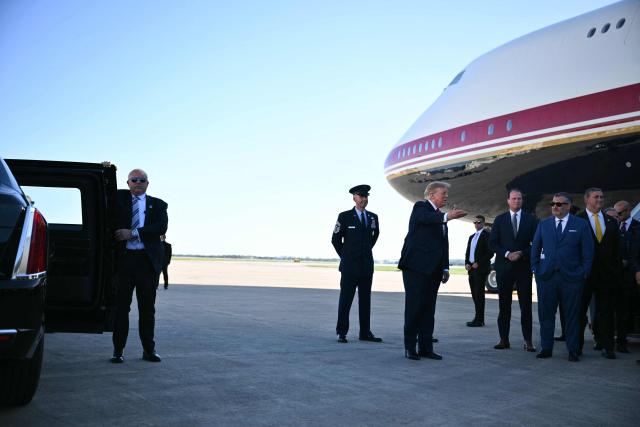 US President Donald Trump gestures after stepping off Air Force One at Kelly Field in San Antonio, Texas, on October 7, 2026. Republican Senate candidate Ken Paxton is in a close race with Democratic candidate James Talarico for one of Texas' US Senate seats. (Photo by Mandel NGAN / AFP)