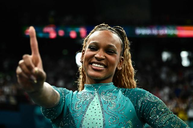 (FILES) Brazil's Rebeca Andrade celebrates after winning the gold medal in the artistic gymnastics women's floor exercise final during the Paris 2024 Olympic Games at the Bercy Arena in Paris, on August 5, 2024. Brazilian Olympic champion Rebeca Andrade will return to competition at the artistic gymnastics world championships after missing last year's edition during a career break taken for mental health reasons, the country's gymnastics confederation said on October 7, 2026. (Photo by Gabriel BOUYS / AFP)