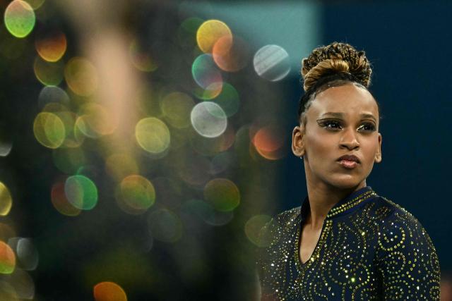 (FILES) Brazil's Rebeca Andrade looks on during the artistic gymnastics women's team final during the Paris 2024 Olympic Games at the Bercy Arena in Paris, on July 30, 2024. Brazilian Olympic champion Rebeca Andrade will return to competition at the artistic gymnastics world championships after missing last year's edition during a career break taken for mental health reasons, the country's gymnastics confederation said on October 7, 2026. (Photo by Loic VENANCE / AFP)