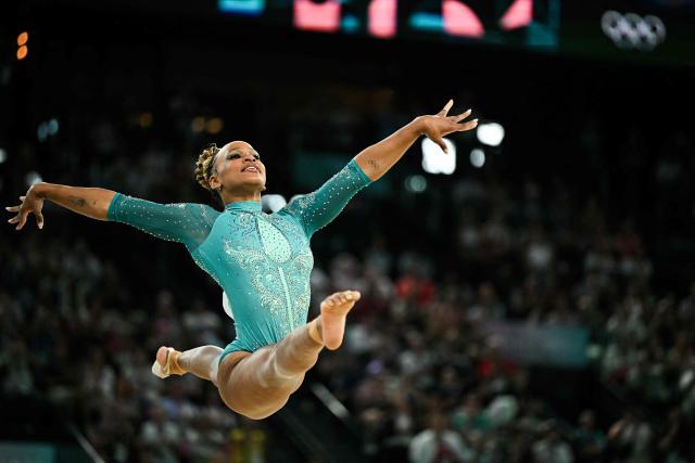 (FILES) Brazil's Rebeca Andrade competes in the artistic gymnastics women's floor exercise final during the Paris 2024 Olympic Games at the Bercy Arena in Paris, on August 5, 2024. Brazilian Olympic champion Rebeca Andrade will return to competition at the artistic gymnastics world championships after missing last year's edition during a career break taken for mental health reasons, the country's gymnastics confederation said on October 7, 2026. (Photo by Gabriel BOUYS / AFP)