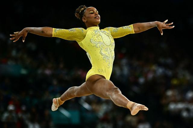 (FILES) Brazil's Rebeca Andrade competes in the floor exercise event of the artistic gymnastics women's all around final during the Paris 2024 Olympic Games at the Bercy Arena in Paris, on August 1, 2024. Brazilian Olympic champion Rebeca Andrade will return to competition at the artistic gymnastics world championships after missing last year's edition during a career break taken for mental health reasons, the country's gymnastics confederation said on October 7, 2026. (Photo by Loic VENANCE / AFP)