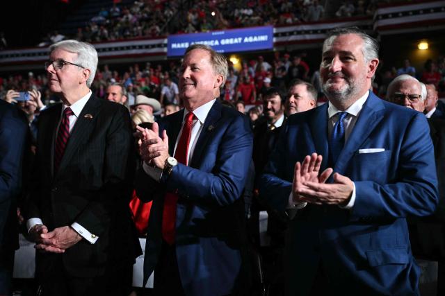 Republican candidate for US Senate Ken Paxton (C) and current Senator Ted Cruz (R) applaud as US President Donald Trump speaks at a campaign rally at the Freeman Coliseum in San Antonio, Texas, on October 7, 2026. Republican Senate candidate Ken Paxton is in a close race with Democratic candidate James Talarico for one of Texas' US Senate seats. (Photo by Mandel NGAN / AFP)