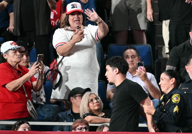 A protester is detained and removed from the venue by Sheriff deputies as US President Donald Trump speaks during a campaign rally at the Freeman Coliseum in San Antonio, Texas, on October 7, 2026. Republican Senate candidate Ken Paxton is in a close race with Democratic candidate James Talarico for one of Texas' US Senate seats. (Photo by Mandel NGAN / AFP)