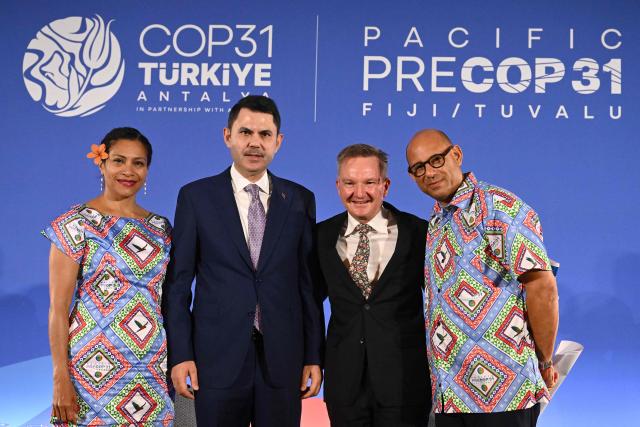 Lynda Tabuya (L), Fijian Minister for Information, Environment and Climate, poses for pictures with Murat Kurum, Turkeys Minister of Environment, Urbanisation and Climate Change, (2nd L), Chris Bowen, President of Negotiations for COP31 and Australian Minister for Climate and Energy and Simon Stiell, UN Climate Representative after the joint press conference at Pacific Pre-COP31 Summit in Nadi, Fiji on October 8, 2026. This week's "pre-COP" meetings in the Fijian city of Nadi are a precursor to the larger UN-sponsored global climate summit -- known as COP31 -- to be held in Turkey next month. (Photo by Saeed KHAN / AFP)
