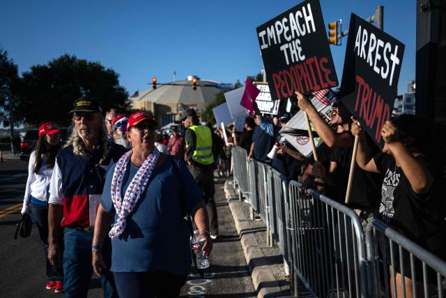Protestors rally against US President Donald Trump outside Freeman Coliseum, where Trump is speaking at a campaign rally, in San Antonio, Texas, on October 7, 2026. Republican Senate candidate Ken Paxton is in a close race with Democratic candidate James Talarico for one of Texas' US Senate seats. (Photo by RONALDO SCHEMIDT / AFP)