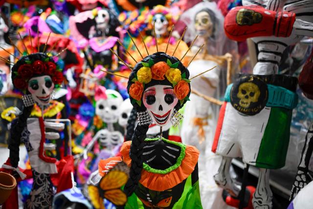Skulls made using a traditional papier-mache technique are seen at the Jamaica Market in Mexico City on October 7, 2026. (Photo by Alfredo ESTRELLA / AFP)