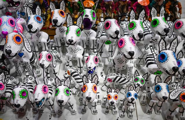 Skulls made using a traditional papier-mache technique are seen at the Jamaica Market in Mexico City on October 7, 2026. (Photo by Alfredo ESTRELLA / AFP)