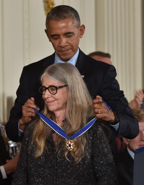 (FILES) US President Barack Obama presents mathematician and computer scientist Margaret Hamilton with the Presidential Medal of Freedom, the nation's highest civilian honor, during a ceremony honoring 21 recipients, in the East Room of the White House in Washington, DC, November 22, 2016. Hamilton, who led the development of the computer system used by NASA's Apollo lunar program, has died at the age of 90, the Massachusetts Institute of Technology (MIT), where she worked for nearly twenty years, announced on October 7, 2026 (Photo by Nicholas Kamm / AFP)