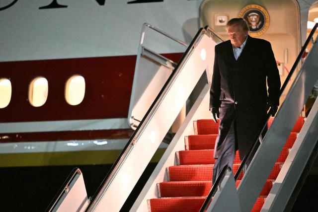 US President Donald Trump steps off Air Force One upon arrival at Joint Base Andrews, Maryland in the early hours of October 8, 2026. Trump is returning from San Antonio, Texas where he spoke at a midterm elections campaign rally. (Photo by Mandel NGAN / AFP)