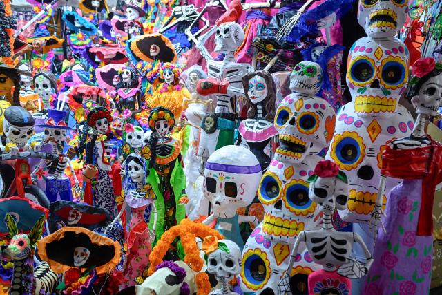 TOPSHOT - Skulls made using a traditional papier-mache technique are seen at the Jamaica Market in Mexico City on October 7, 2026. (Photo by Alfredo ESTRELLA / AFP)