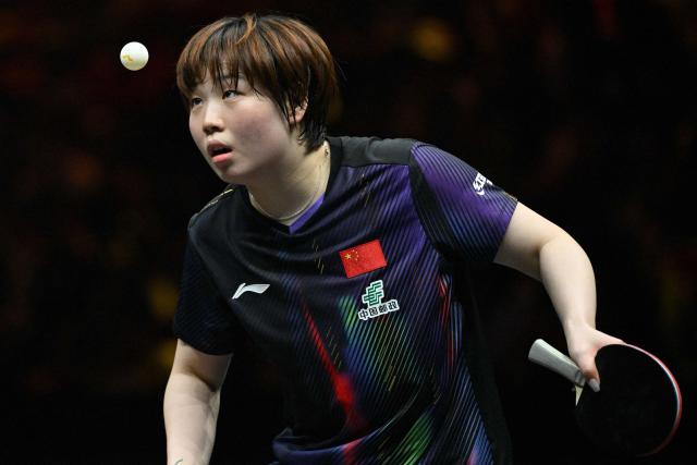 China’s Kuai Man hits a return to compatriot Zhu Sibing during their women’s singles match at the China Smash table tennis tournament in Beijing on October 8, 2026. (Photo by ADEK BERRY / AFP)