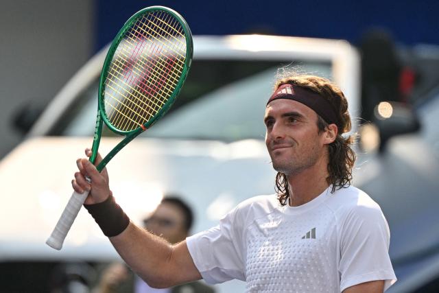 Greece's Stefanos Tsitsipas celebrates after his victory against Belgium's Kimmer Coppejans during their men's singles match at the Shanghai Masters tennis tournament in Shanghai on October 8, 2026. (Photo by Hector RETAMAL / AFP)