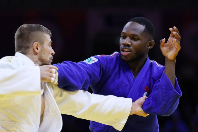 Czechia's David Klammert (white) competes against France's Maxime-Gael Ngayap Hambou in the men's under 90 kg round of 64 at the World Judo Championships in Baku on October 8, 2026. (Photo by Anne-Christine POUJOULAT / AFP)