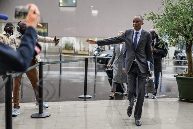 Secretary general of the Senegalese Football Federation Abdoulaye Sow gestures upon his arrival at the Court of Arbitration for Sport (CAS) for a hearing on Senegal’s appeal against Morocco after a chaotic Africa Cup of Nations football final, in Lausanne, on October 8, 2026. Nearly ten months after a chaotic Africa Cup of Nations final, the dispute is set to reach its conclusion in Lausanne, where the Court of Arbitration for Sport (CAS) will hear Senegal’s appeal against Morocco being awarded the title. Senegal had initially won the January 18 final 1-0 after extra time, in a match marred by a lengthy walk-off over a controversial late penalty. (Photo by Fabrice COFFRINI / AFP)