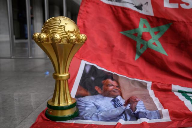 This photograph shows a replica Africa Cup of Nations trophy next to the Court of Arbitration for Sport (CAS) during a hearing on Senegal’s appeal against Morocco following a chaotic Africa Cup of Nations football final, in Lausanne on October 8, 2026. Nearly ten months after a chaotic Africa Cup of Nations final, the dispute is set to reach its conclusion in Lausanne, where the Court of Arbitration for Sport (CAS) will hear Senegal’s appeal against Morocco being awarded the title. Senegal had initially won the January 18 final 1-0 after extra time, in a match marred by a lengthy walk-off over a controversial late penalty. (Photo by Fabrice COFFRINI / AFP)